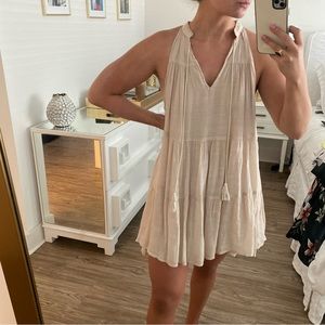 Beige tiered sundress with tassels